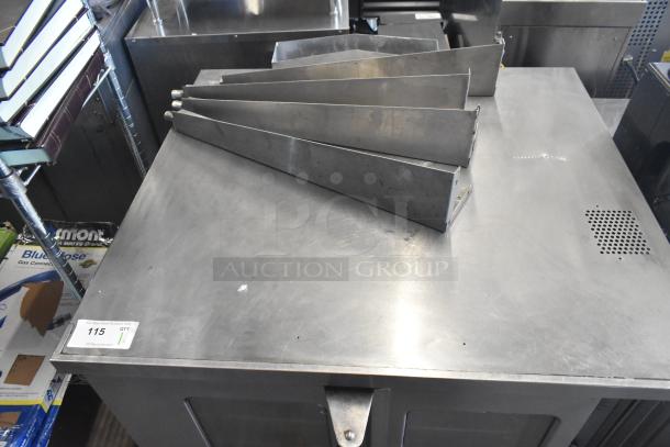 Garland SunFire gas convection oven with view-through doors, thermostatic controls, and metal legs. Visible auction tag.