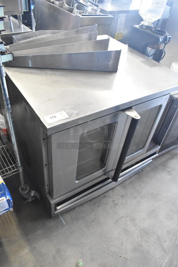 Garland SunFire gas convection oven with view-through doors, thermostatic controls, metal legs; item number 115 visible.