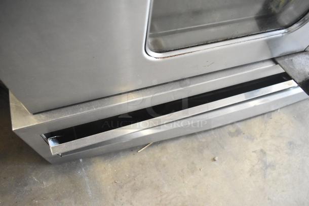 Garland SunFire full-size gas convection oven, features view-through doors, thermostatic controls, and metal legs.