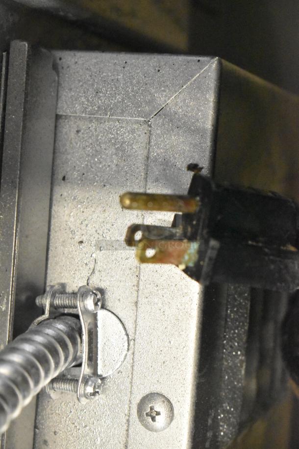 Garland SunFire gas convection oven, view-through doors, thermostatic controls, metal legs, close-up of connector area.