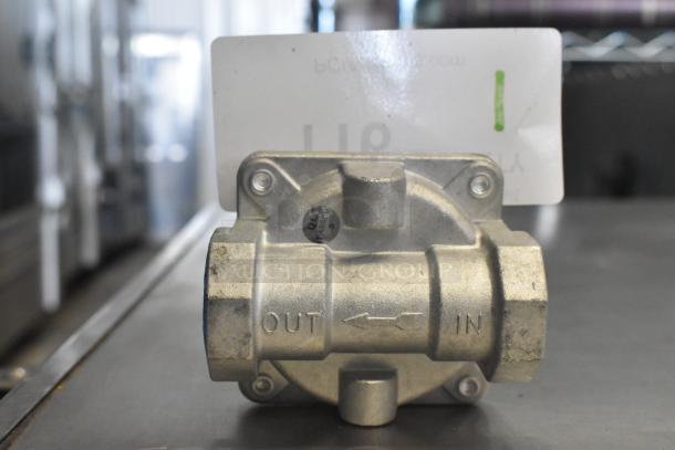 7015-4010 Gas Regulator; metal body; labels indicate "IN" and "OUT" for flow direction; QC passed sticker visible.