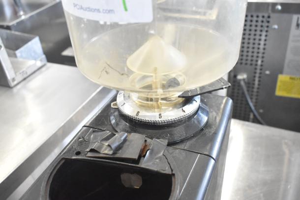 Bregani countertop espresso bean grinder, missing lid, 115 volts, 1 phase, visible wear around grinder dial.