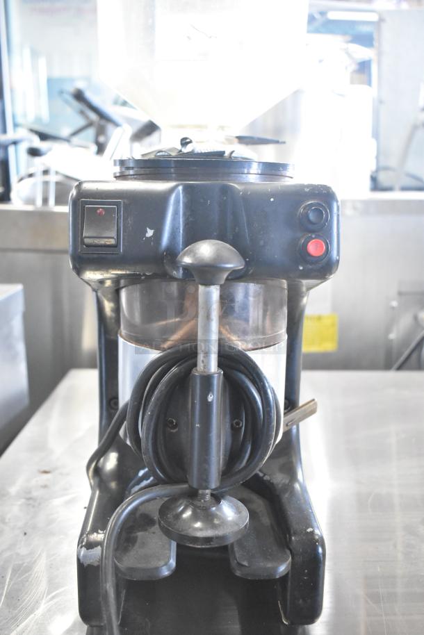 Bregani countertop espresso bean grinder, missing lid, 115 volts, features power switch, visible wear, sturdy base.