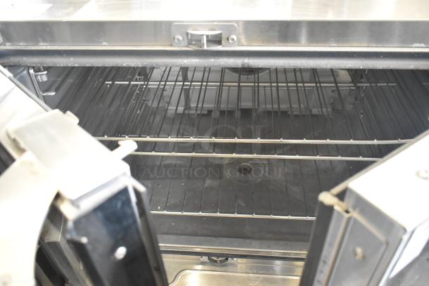Blodgett Hydrovection Helix stainless steel convection oven. Features view-through doors and metal racks. Clean condition.