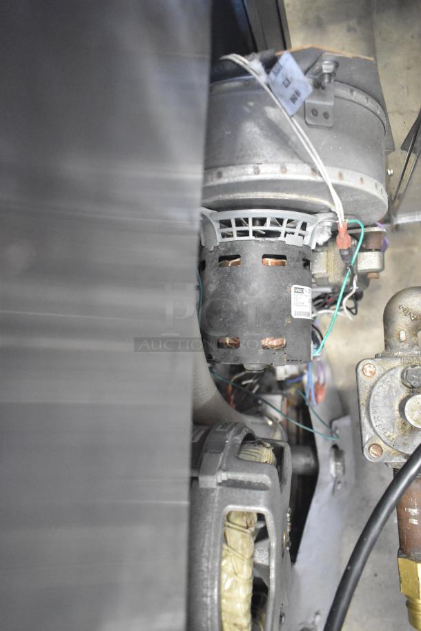 Internal components of Blodgett Hydrovection Helix oven, showing wiring and mechanical parts. Used for commercial convection cooking.