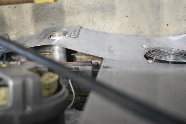 Interior view of Blodgett Hydrovection Helix convection oven, showing metal components and wiring.