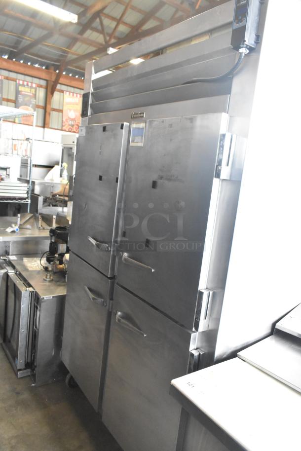Traulsen RHT 2-32NUT commercial cooler with 4 half-size doors, stainless steel, on casters. 115 volts, 1 phase.