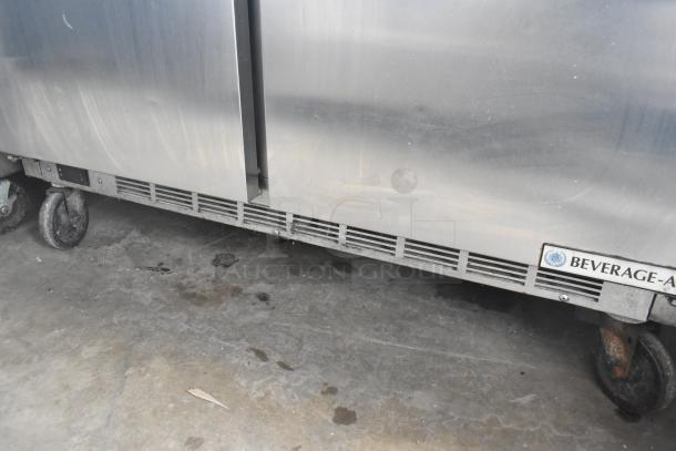 Beverage Air SPE48HC-12C commercial prep table, stainless steel, on casters, 115V, 1 phase, visible logo.