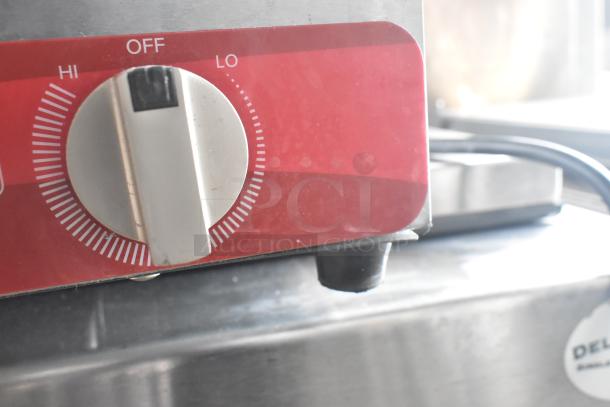 Avantco 177EB202FBM electric hot plate range control dial, showing settings from "Off" to "Hi." Durable stainless steel build.