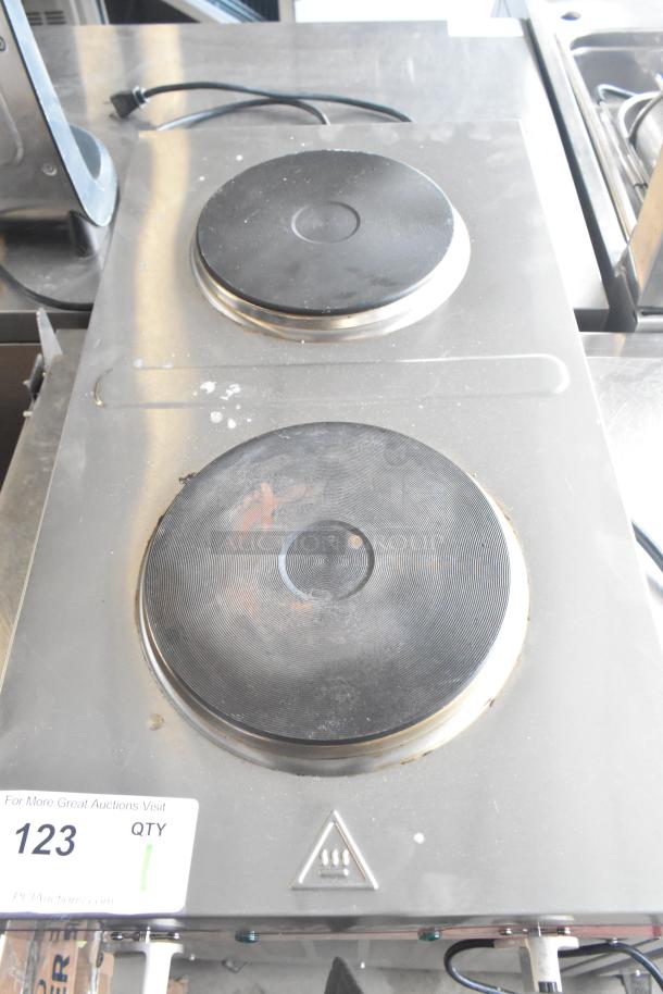 Avantco 177EB202FBM countertop electric hot plate range with 2 burners. Used condition, 240 volts, 1 phase. Auction tag 123 visible.