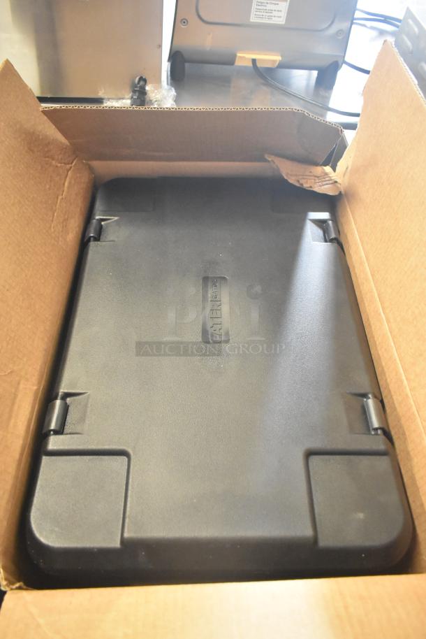 Brand new CaterGator black insulated food pan carrier in box, scratch and dent condition, top-loading with secure latches.