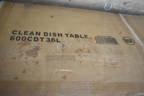 Regency 600CDT36L 3' clean dish table box showing model 600CDT36L, NSF marking, slight scratches. Condition: New with dents.