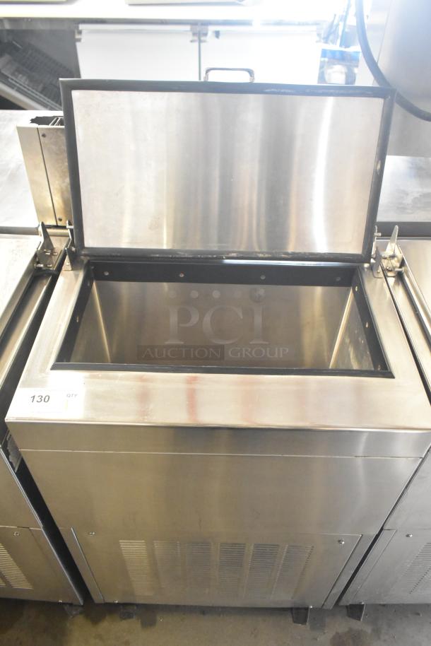 Glastender FRM-2 commercial 24" mobile ice cream freezer, stainless steel, two-tub capacity, on commercial casters, open lid.