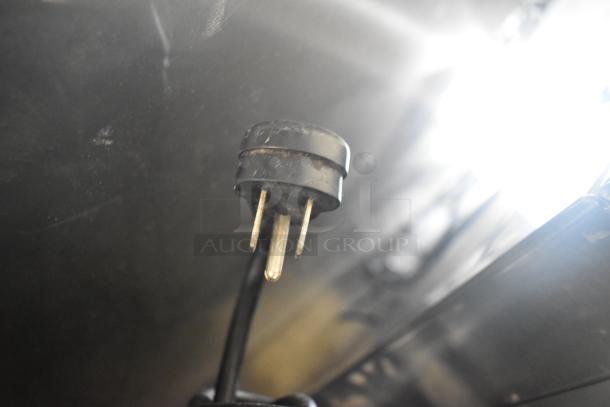 Close-up of a power plug for Glastender FRM-2 ice cream freezer, highlighting electrical compatibility.