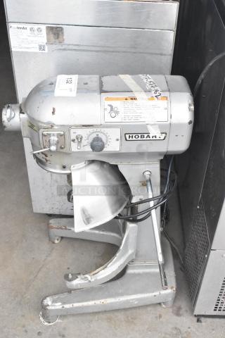 Hobart A200 commercial dough mixer, countertop model, 115 volts, 1 phase. Visible wear, includes control panel markings and Hobart label.