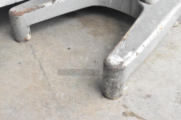 Close-up of the Hobart A200 dough mixer's metal foot with visible wear and rust.