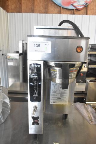 Fetco CBS-2031e commercial countertop coffee machine in stainless steel, 120 volts, 1 phase, with controls and caution labels visible.