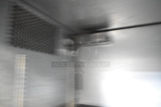 True TBB-24-48G-SD-S-LD Back Bar Cooler interior view, showing shelves and cooling unit, 115 volts, for commercial use.