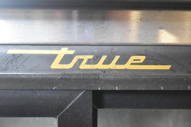 True TBB-24-48G-SD-S-LD back bar cooler, black finish, visible True logo, 115 volts, 1 phase, commercial use.