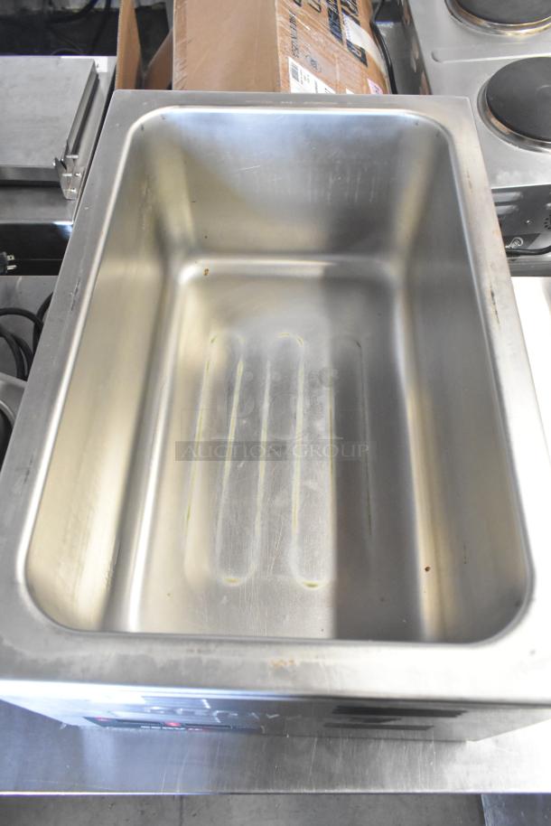 ServIt 423FW150 countertop food warmer, 120 volts, 1 phase, stainless steel, clean interior, used condition.