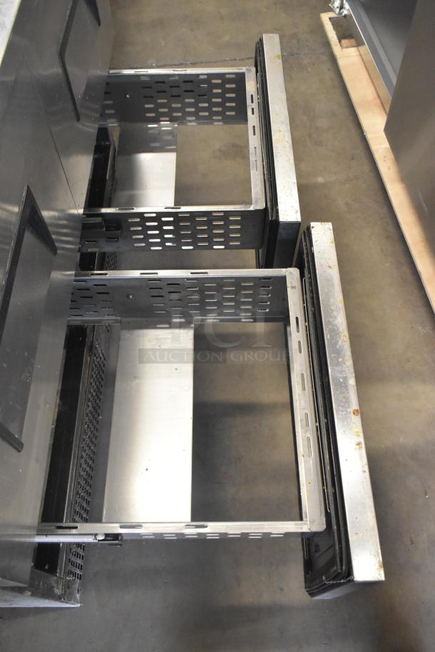 True TFP-48-18M-D-4 prep table with open stainless steel drawers on casters, showing interior structure. 115V, 1 Phase.