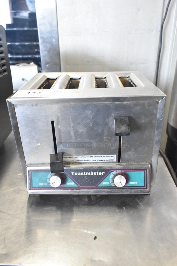 Toastmaster TP409 4-slot toaster, countertop model. Features adjustable browning dials. 115 volts, 1 phase. Used condition.