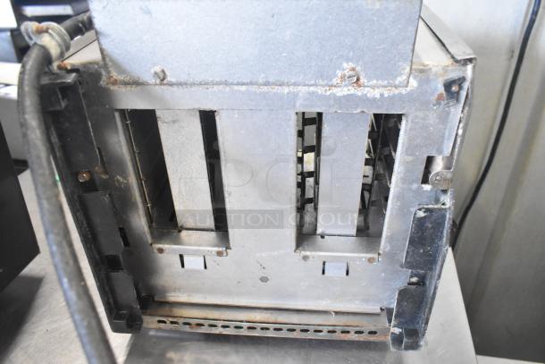 Toastmaster TP409 4-slot toaster, countertop model, showing wear, metal finish, 115 volts, 1 phase, visible rust on edges.