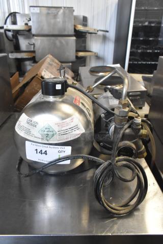 McCann's Motor, 115 Volts, 1 Phase, appears in used condition. Features labels indicating carbon dioxide content and safety warnings.