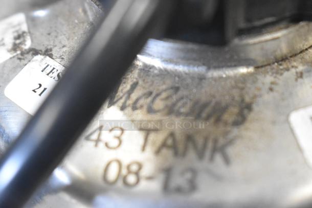 McCann's Motor, 115 Volt, 1 Phase, engraved label "43 TANK 08-13," visible wear, industrial use.