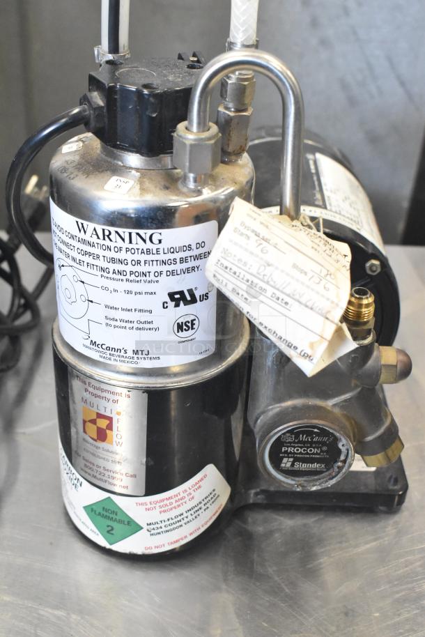 McCann's Motor, 115 Volt, 1 Phase, features warning labels, Multi-Flow property tag, Procon pump. Good condition.