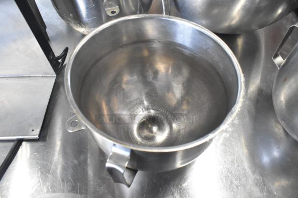 Stainless steel mixing bowls and whisk attachment, includes A-30SS 30 quart bowl. Good condition, ideal for kitchen use.