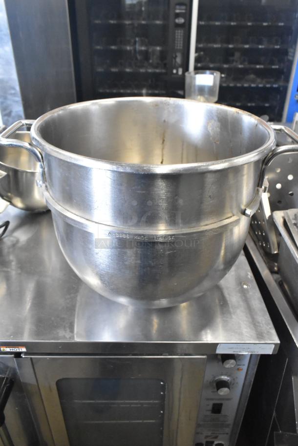 5 kitchen items including 4 stainless steel mixing bowls and 1 whisk attachment. Featured A-30SS 30-quart bowl.