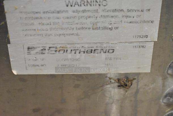 Southbend SLGS/12SG convection oven label with serial number 2489807 and gas type NA1, showing wear and residue.