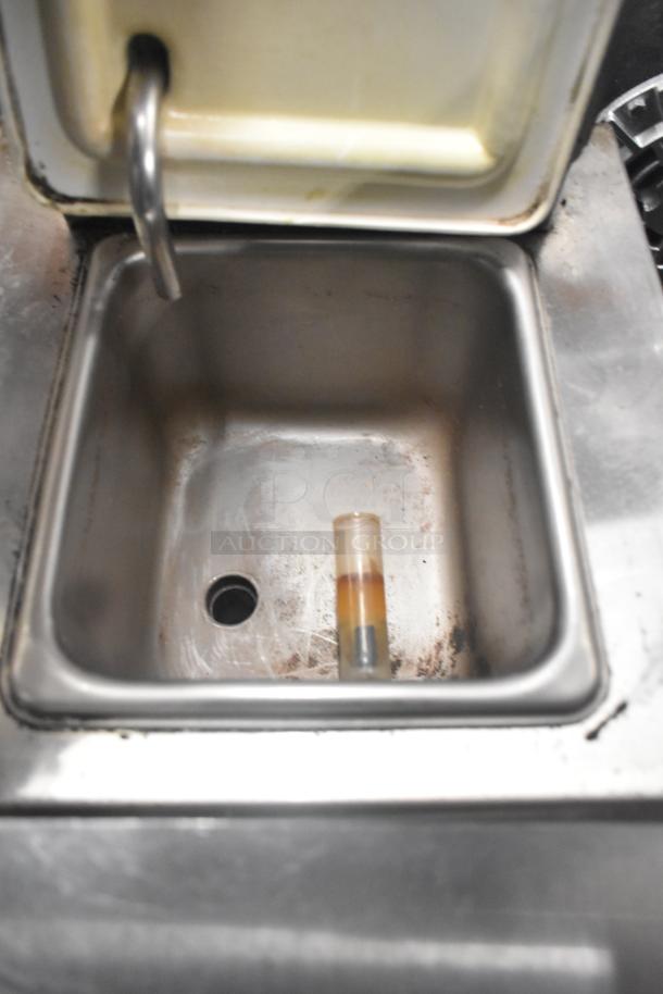 Taylor RD30-12 frozen drink machine interior with visible wear. Item is a commercial countertop model, 115 volts, 1 phase.