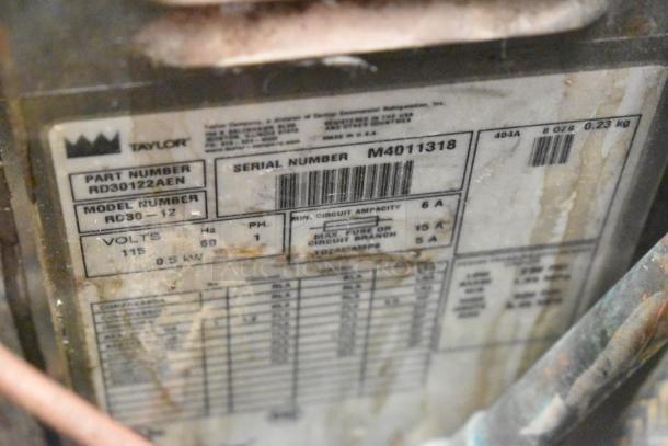 Taylor RD30-12 single flavor frozen drink machine, 115V, 1 phase. Label shows part and serial numbers, power specs.