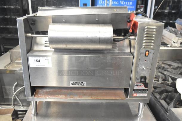 APW Wyott M-83 commercial vertical conveyor bun grill toaster, 240V, 1 phase, includes caution label, good condition.
