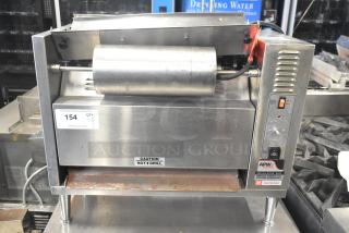APW Wyott M-83 commercial vertical conveyor bun grill toaster, 240V, 1 phase, includes caution label, good condition.