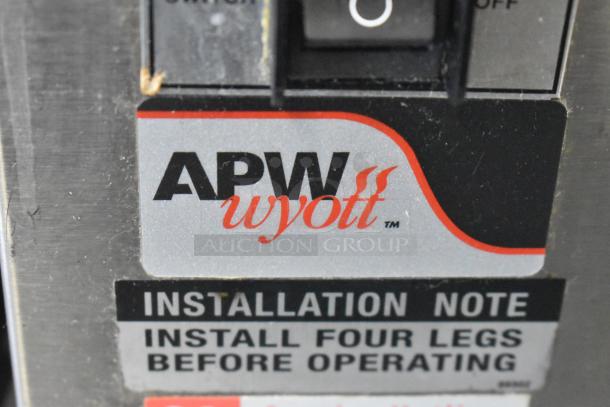 APW Wyott M-83 Bun Grill Toaster label, showing brand logo and installation note. Used for commercial vertical toasting. 240V.