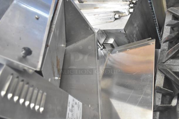 APW Wyott M-83 vertical conveyor bun grill toaster, 240 volts, 1 phase, stainless steel, showing internal components.