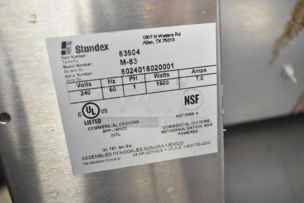 APW Wyott M-83 conveyor bun toaster. 240V, 1 phase, 1600W. UL and NSF certified. Good condition with visible labels.