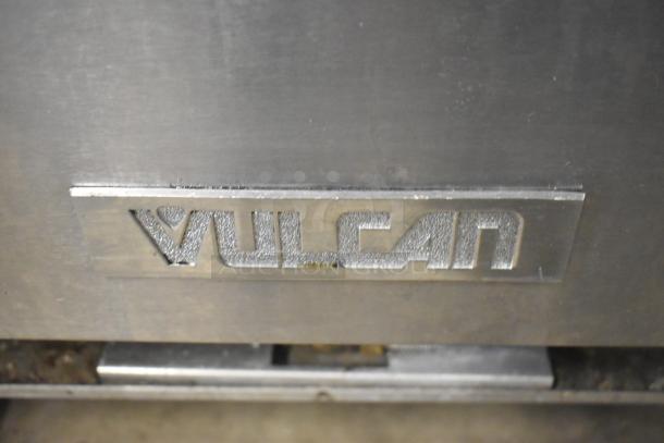 Vulcan V6B36S-502 commercial 6 burner gas range with oven, on casters, shown with Vulcan logo.