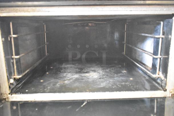 Vulcan V6B36S-502 commercial gas oven interior, showing clean racks and spacious cooking area.