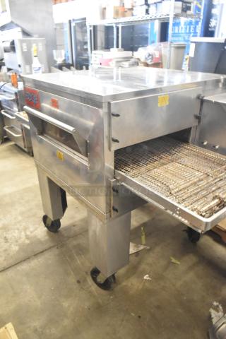 MF&B EDGE-1830-M Conveyor Pizza Oven, commercial natural gas powered, single deck, on casters, visible logo and safety labels.