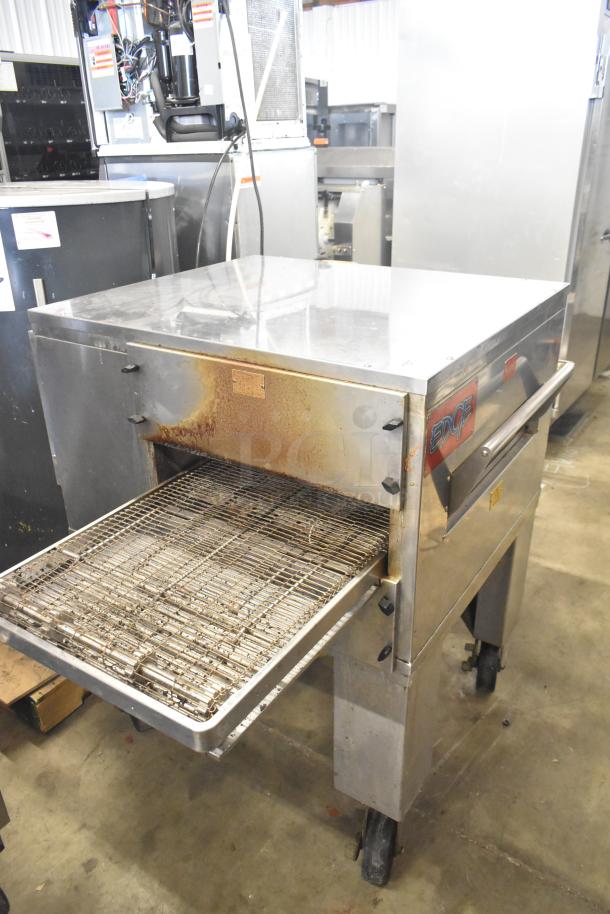 MF&B EDGE-1830-M commercial gas conveyor pizza oven, single deck, on casters, visible wear, model label on side.