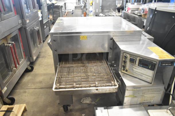 MF&B EDGE-1830-M commercial gas-powered conveyor pizza oven, stainless steel, on commercial casters, visible control panel.