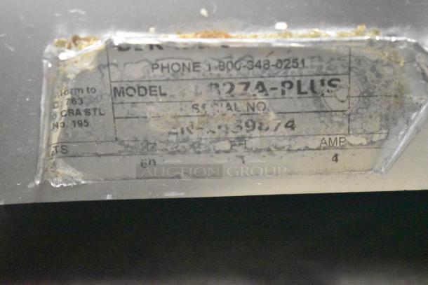 Berkel 827A-PLUS meat slicer model plate showing model and serial number, slightly worn condition.