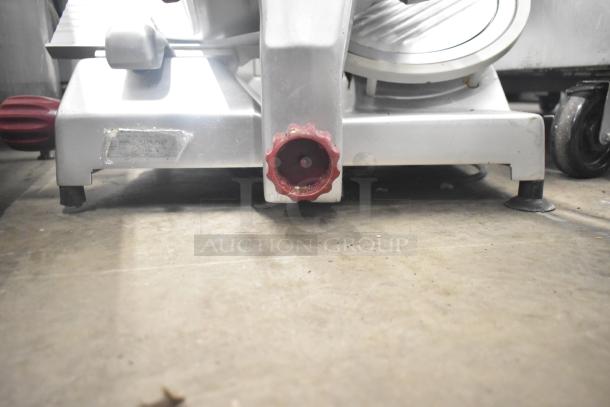 Berkel 827A-PLUS countertop meat slicer with blade sharpener, silver with red knob, in good condition, 115V, 1 phase.