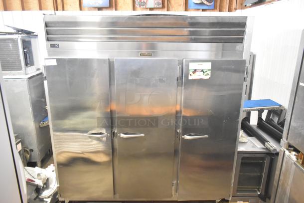 2018 Traulsen G31010 3-door commercial freezer, stainless steel, on casters, 115V. Good condition with visible control panel.