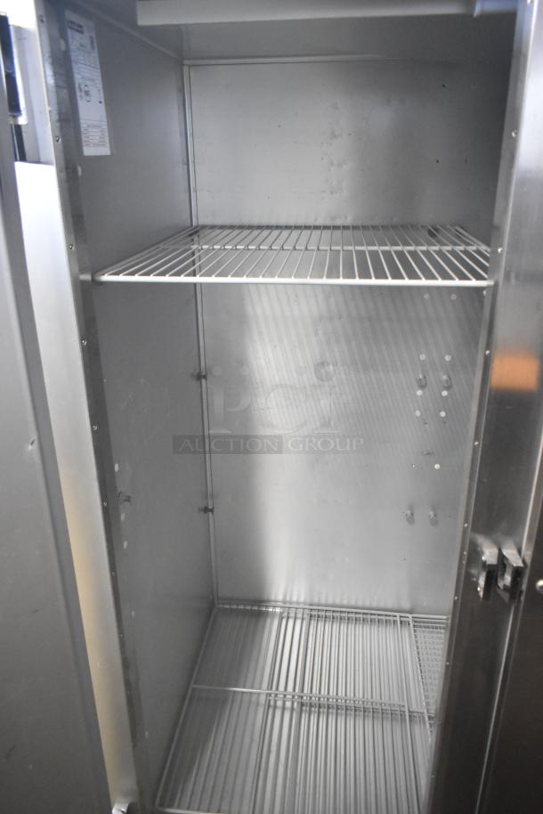 2018 Traulsen G31010 commercial 3-door reach-in freezer, stainless steel, with shelving, on casters, 115V, 1 phase.