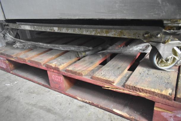 Rational SCCWE62/SCCWE102 convection ovens on commercial casters, stainless steel, 480V, 3-phase, set on a pallet.